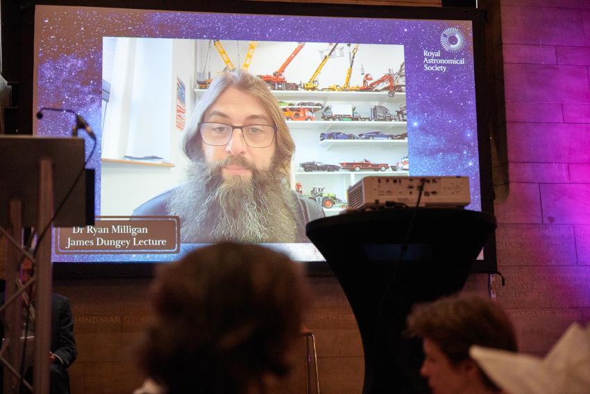Dr Ryan Milligan,&nbsp;of Queen's University Belfast, delivers a recorded video message after being awarded the James Dungey Lectureship.