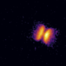 Image from HST showing the bipolar outflow of material ejected by the helium nova V445 Puppis. The progenitor binary star system is just about visible in the centre of the outflow. Also visible are the 'bullets' of gas that were shot out at either end of the outflow. Image taken in 2013 with the F502N filter on Hubble’s Wide Field Camera 3.